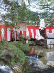 Here's a spot where you (apparently - well, I was just following the others) wash your coin in the running stream, make a little blessing and offer that coin to the shrine by throwing it into a box placed inside the pond. Religion meets Timezone?