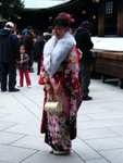 New adult wearing a kimono with long sleeves that drape down