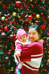 In front of Christmas tree