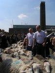 Rogers and Piano leading the sheep crossing the millennum bridge in front of the Tate Modern 